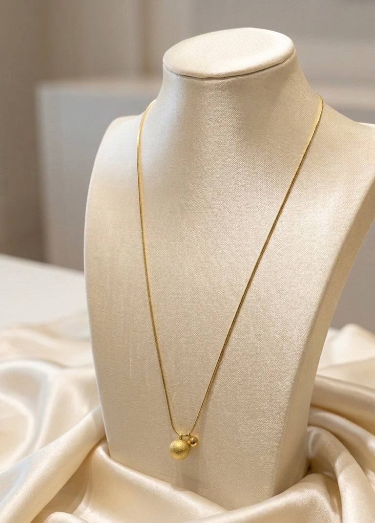 Eleganzperlen im goldenen Duo