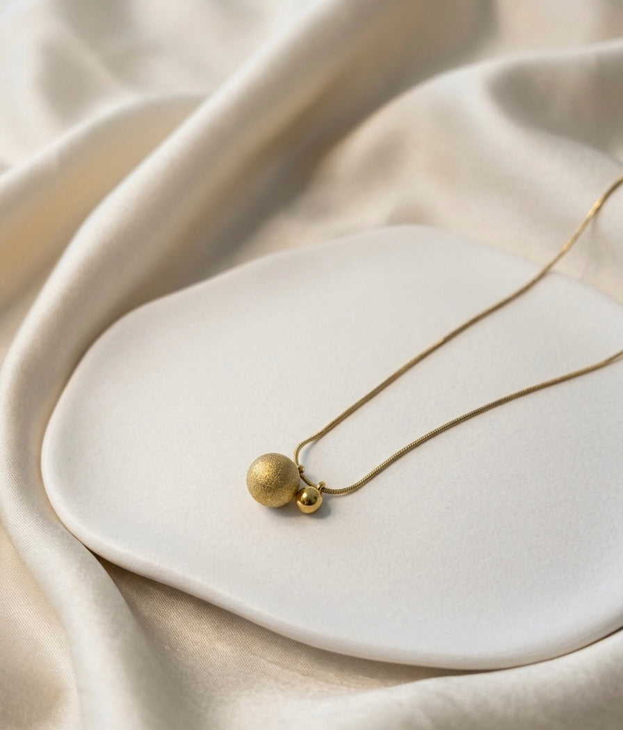 Eleganzperlen im goldenen Duo